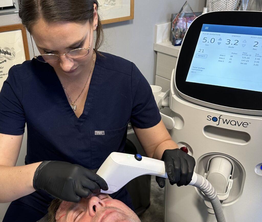 Megan doing a Sofwave treatment on client