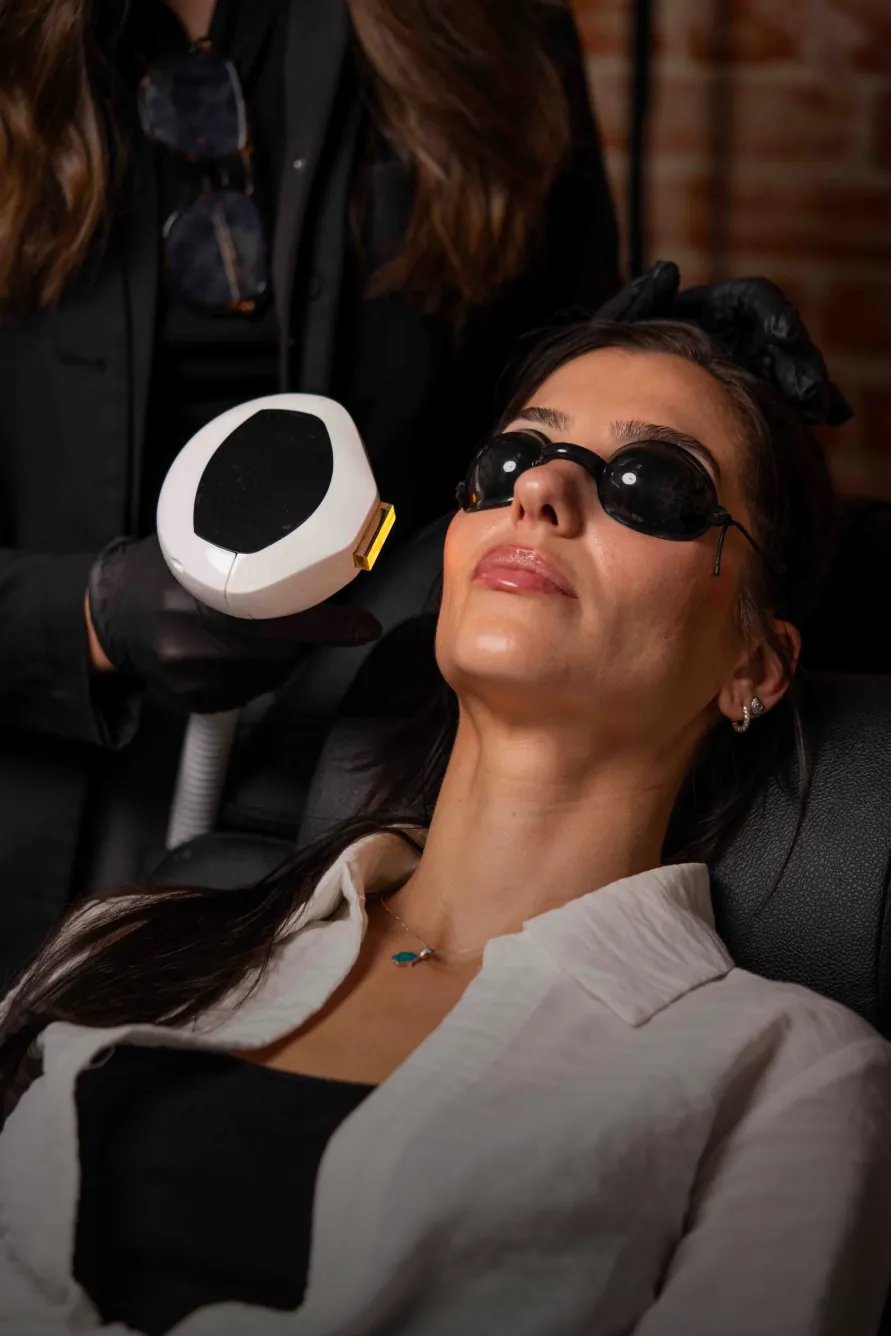 Patient wearing protective eyewear during an IPL photofacial